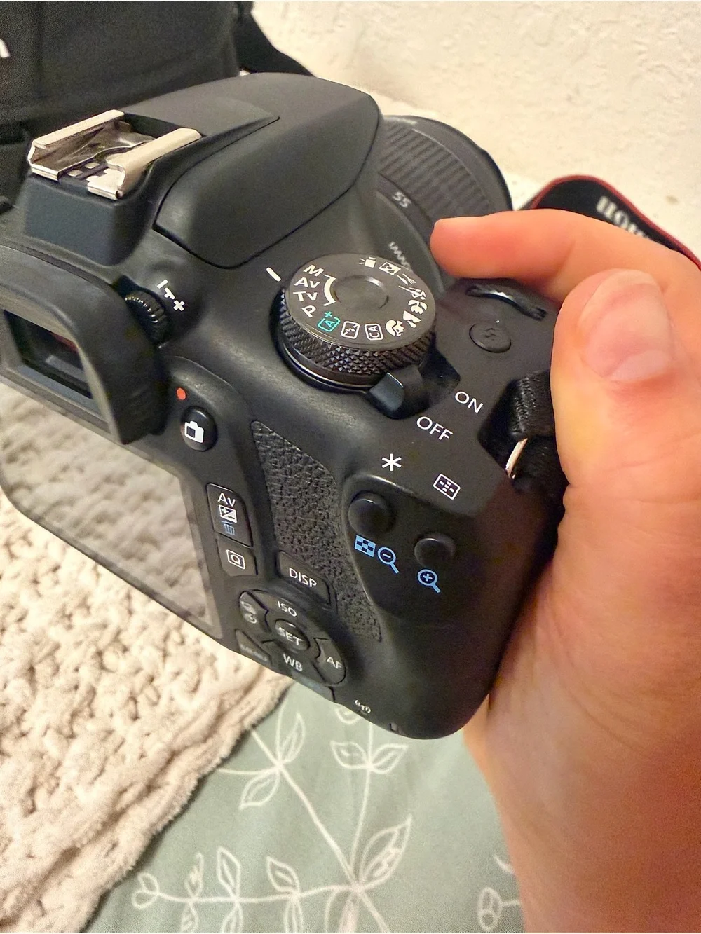Canon DSLR Camera with Zoom Lens and Black Carrying Bag